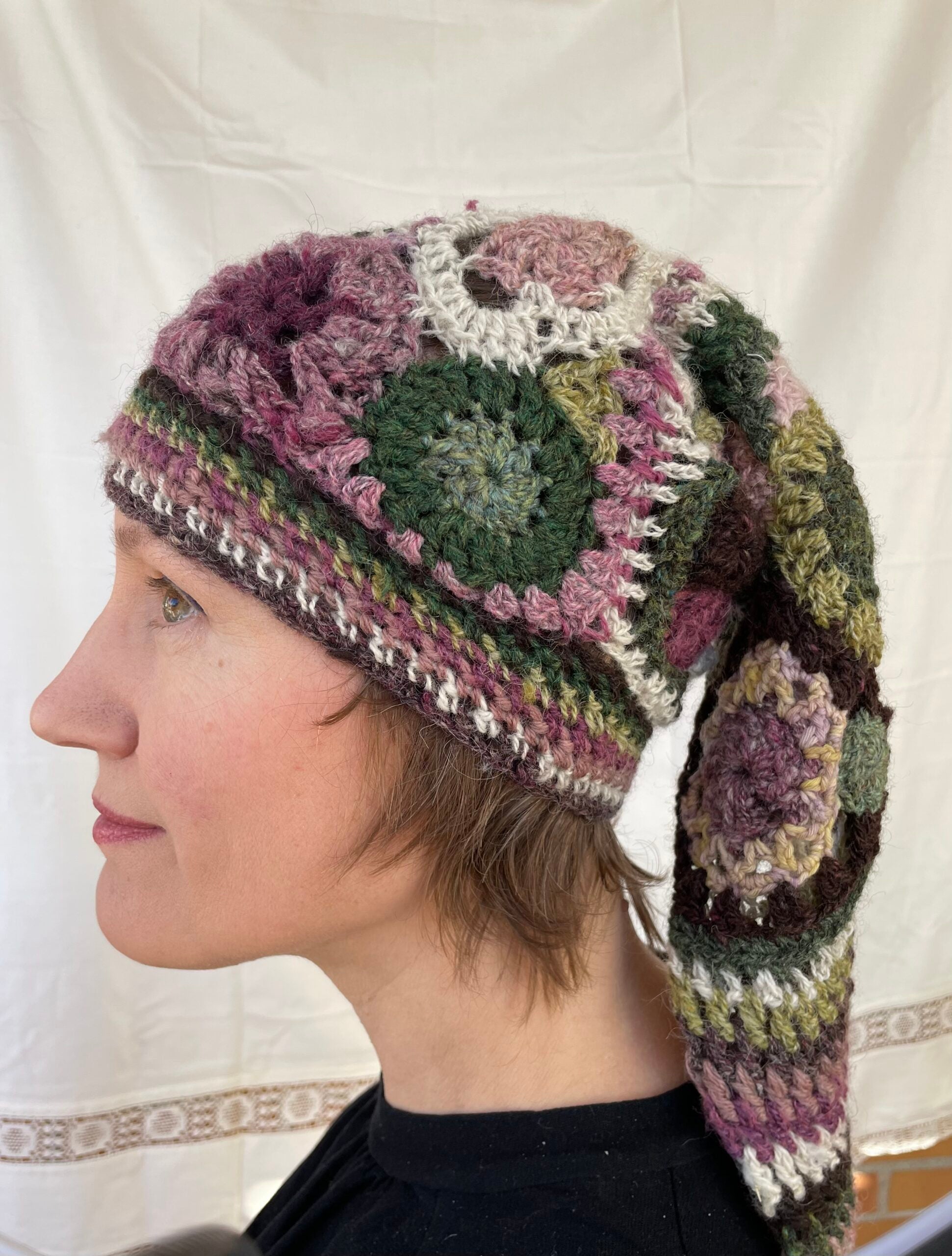 Heather, freeform crochet stocking cap with multicoloured tassel