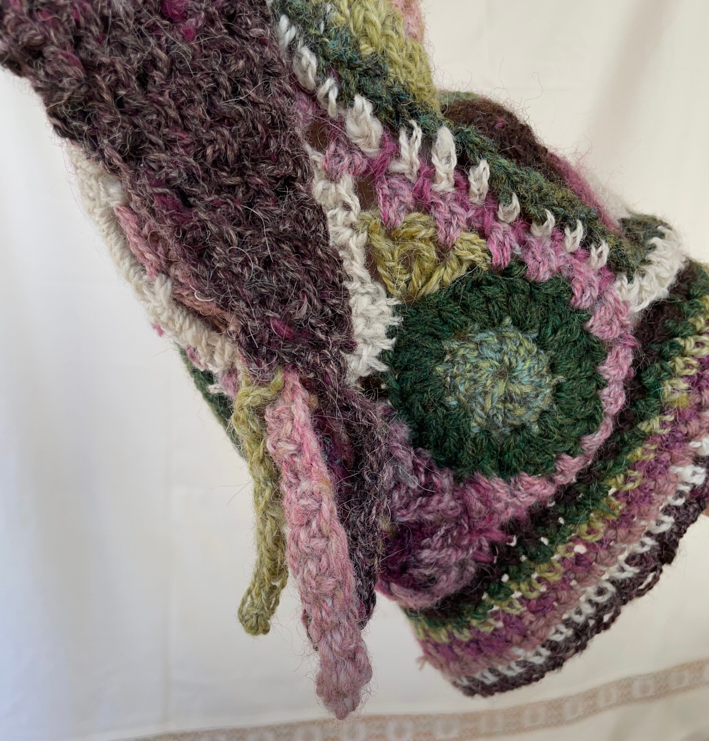 Heather, freeform crochet stocking cap with multicoloured tassel