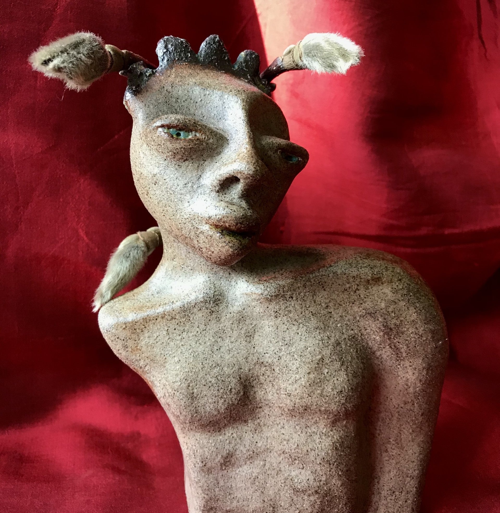 Faun, skulptur i grå lava, glaserad