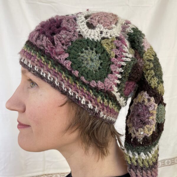 Heather, freeform crochet stocking cap with multicoloured tassel