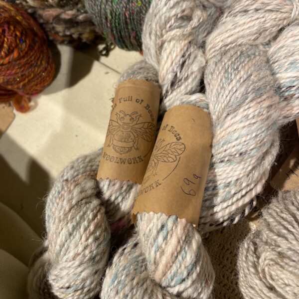 White, pink and blue handspun yarn, 69g